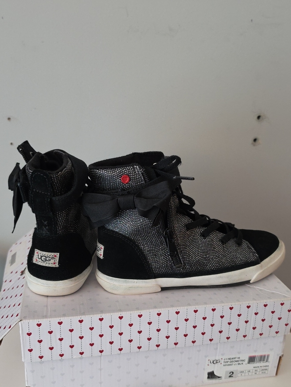UGG Kids Black and Silver High-Top Sneakers with Bow Accent